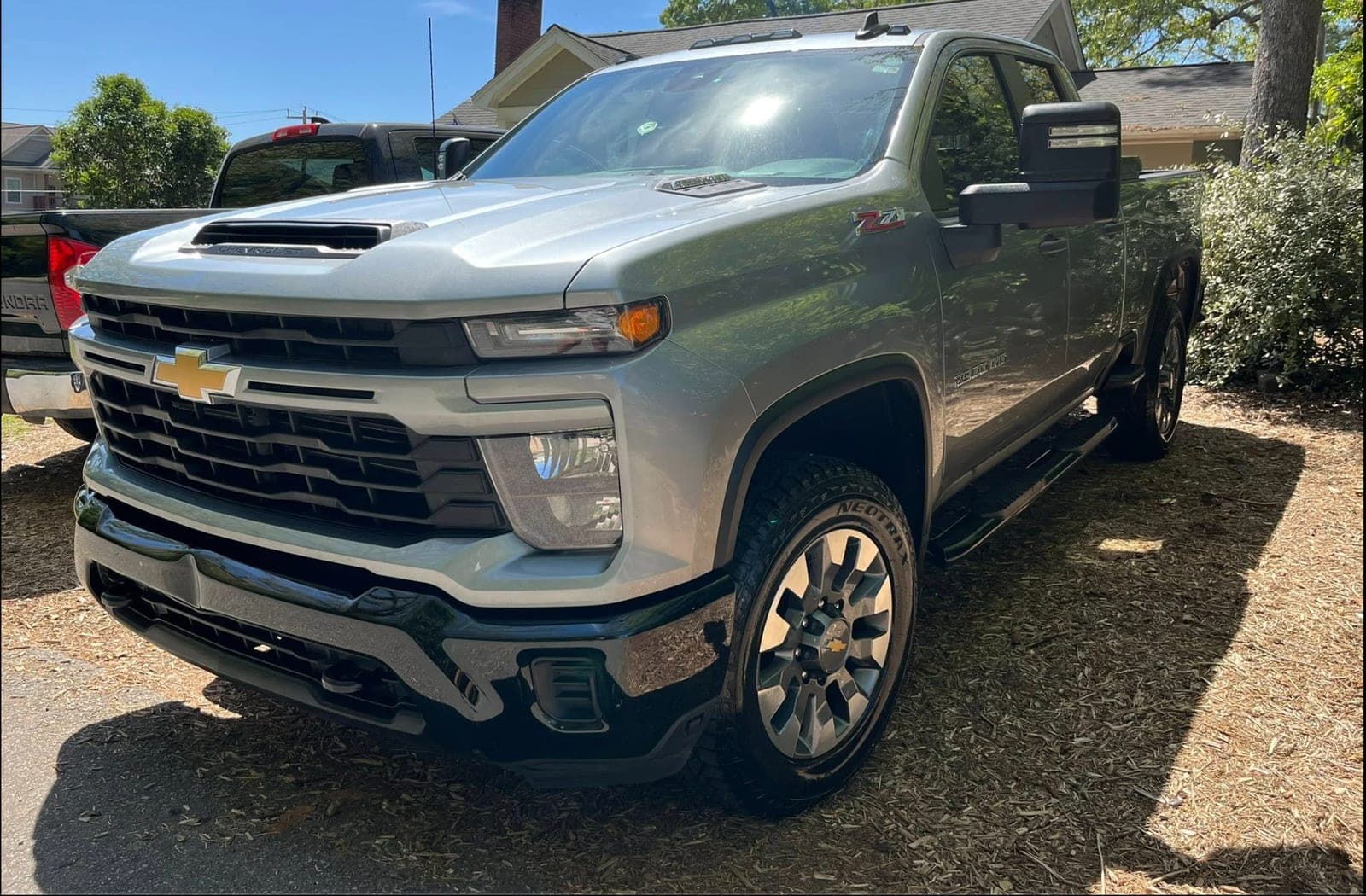 Reflective clean paint on a gray Chevrolet Silverado HD Z71 — the kind of finish a ceramic coating maintains.