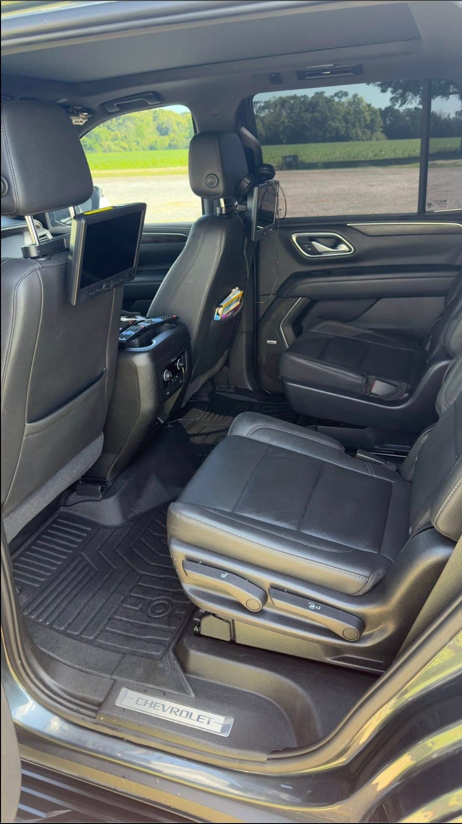 Second-row leather seats and floor mats of a Chevrolet Tahoe after a ShineCraft interior detail in the KC metro.